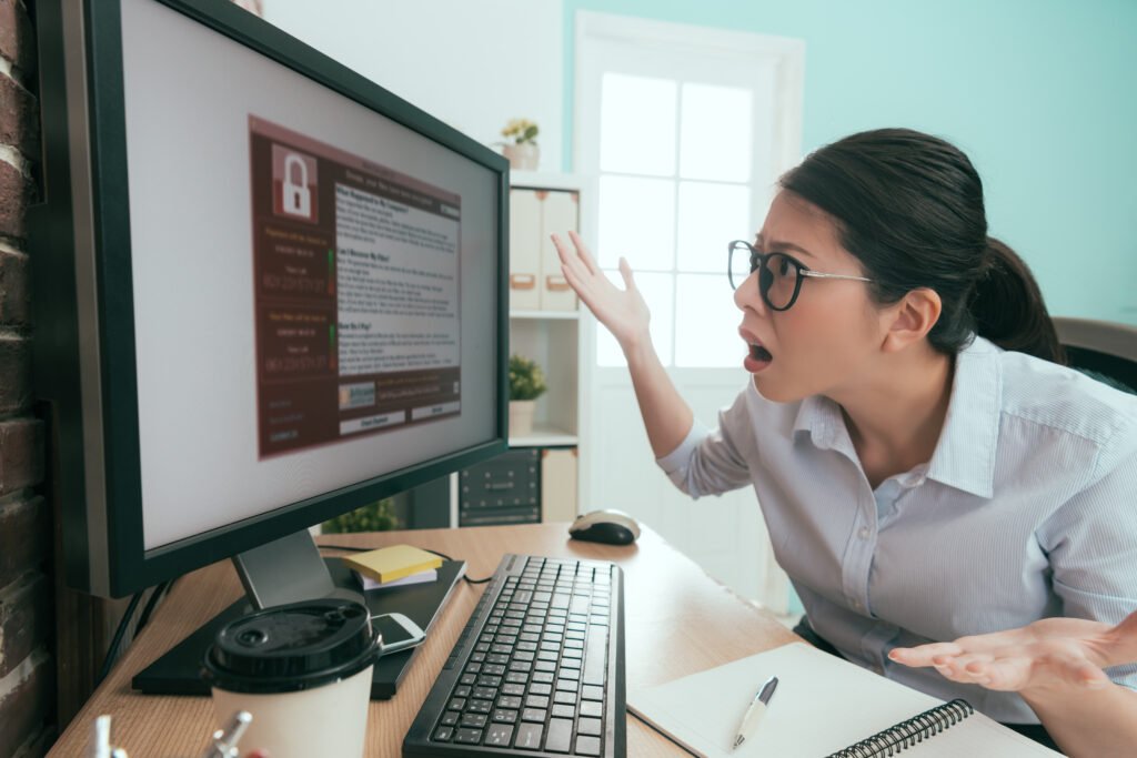 Frustrated person locked out of computer - password lockout concept
